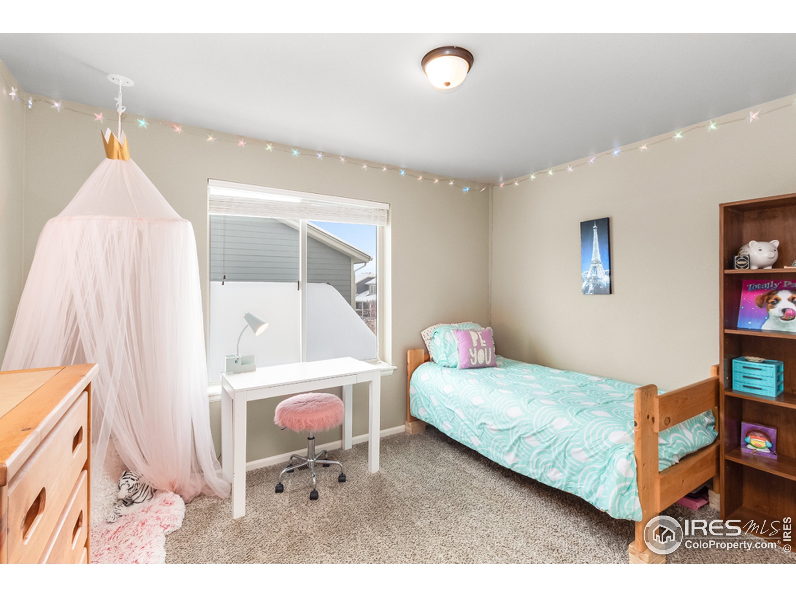 6559 Tombstone Ridge Road Timnath, CO 80547 - Photo 18 of 30 a bedroom with a bed and a dresser in it