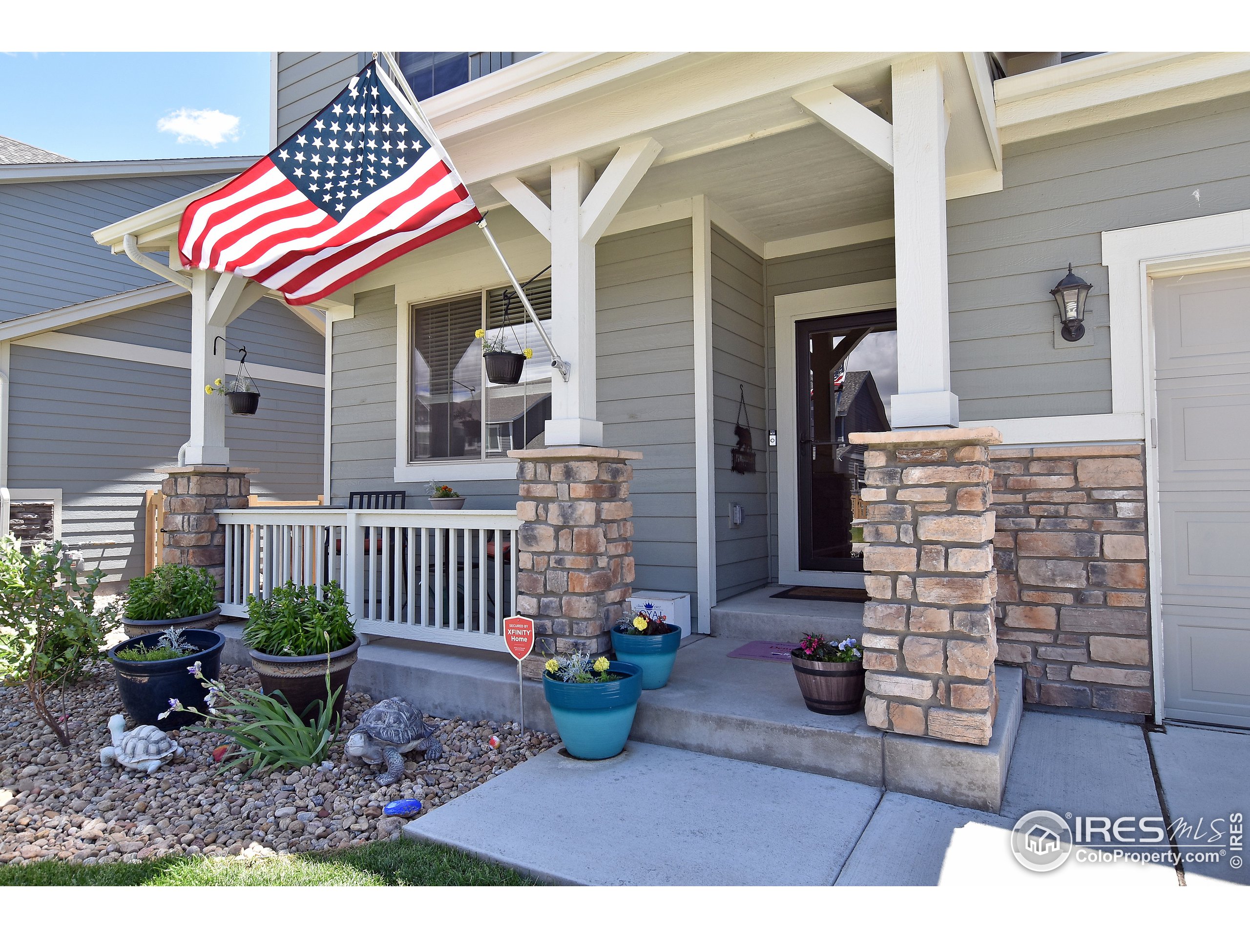 6559 Tombstone Ridge Road Timnath, CO 80547 - Photo 2 of 30 a front view of a house with balcony