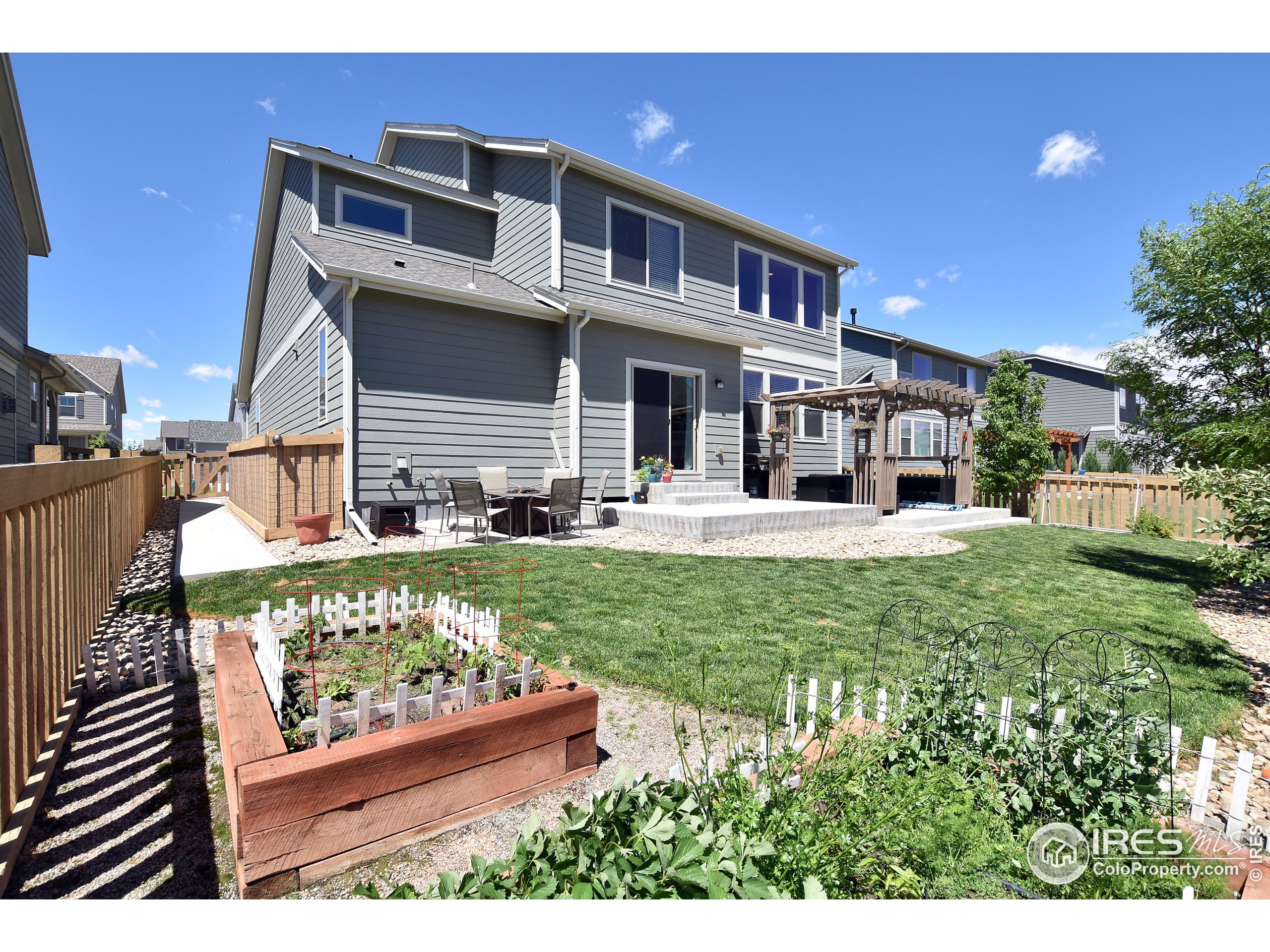 6559 Tombstone Ridge Road Timnath, CO 80547 - Photo 24 of 30 a front view of a house with a yard