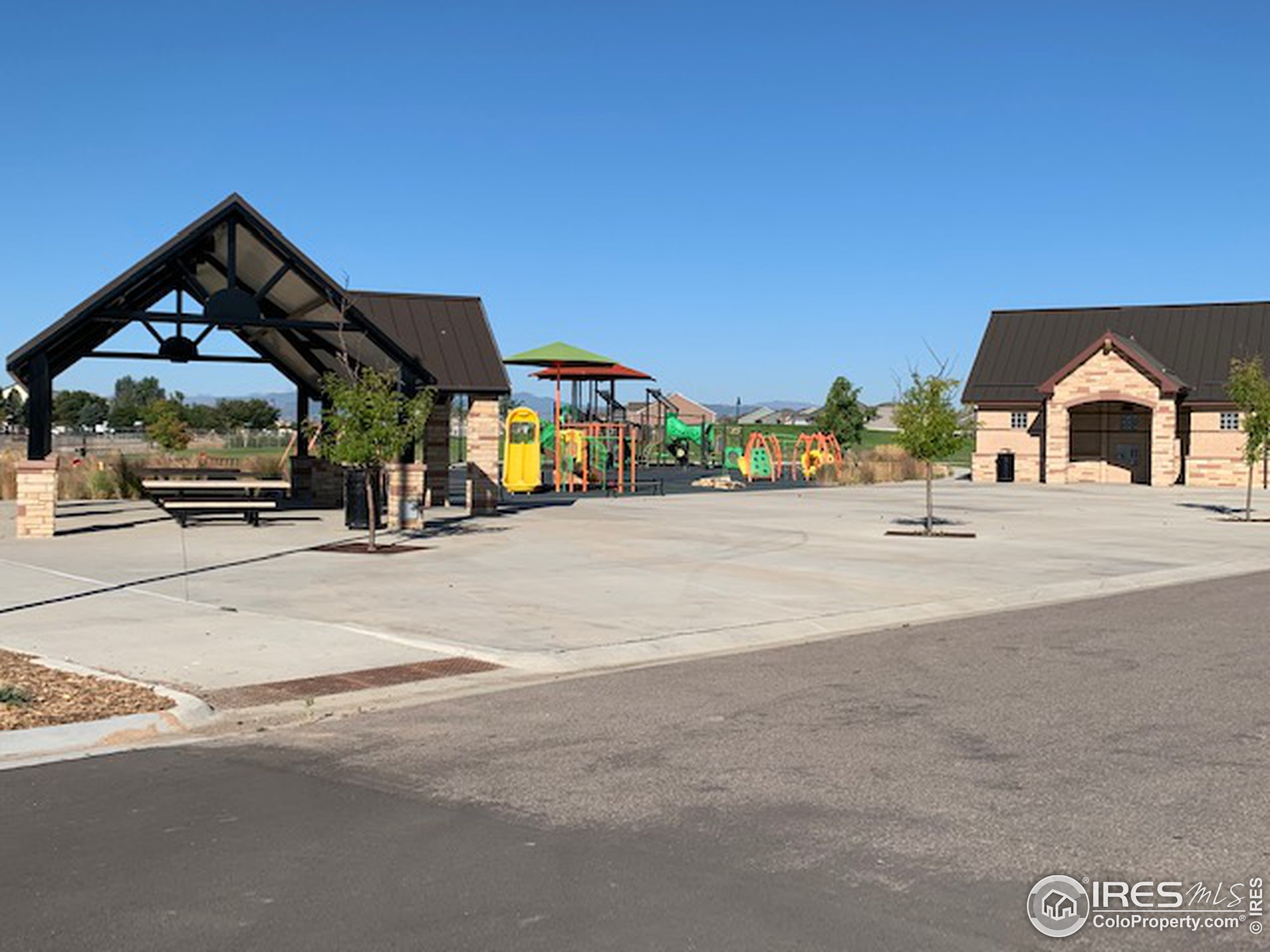6559 Tombstone Ridge Road Timnath, CO 80547 - Photo 28 of 30 a view of a house with outdoor space and sitting area