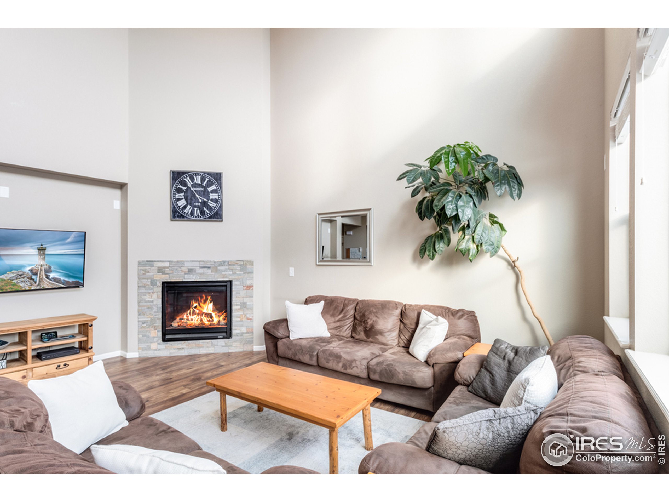 6559 Tombstone Ridge Road Timnath, CO 80547 - Photo 4 of 30 a living room with furniture and a fireplace