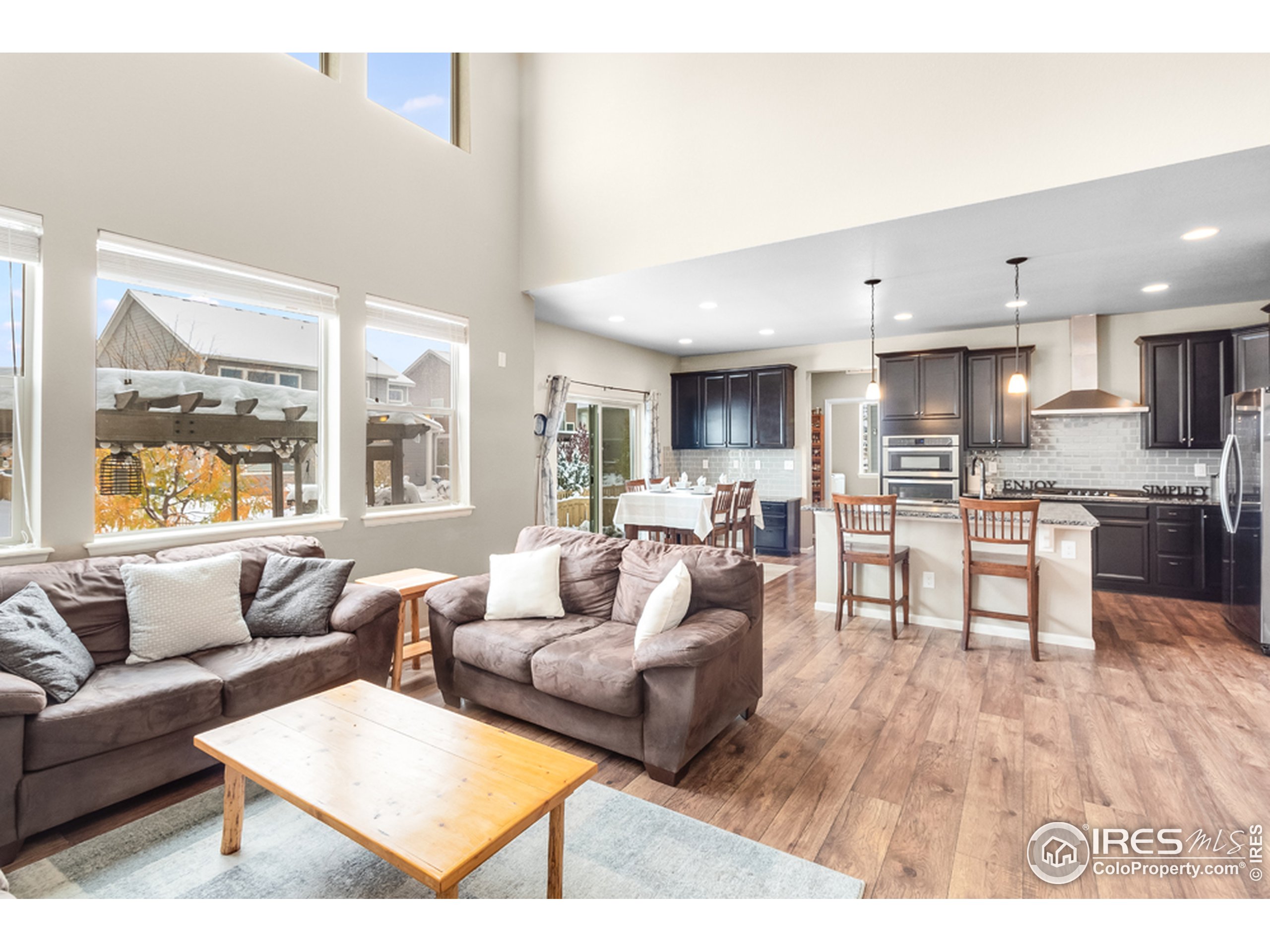 6559 Tombstone Ridge Road Timnath, CO 80547 - Photo 5 of 30 a living room with furniture and a large window