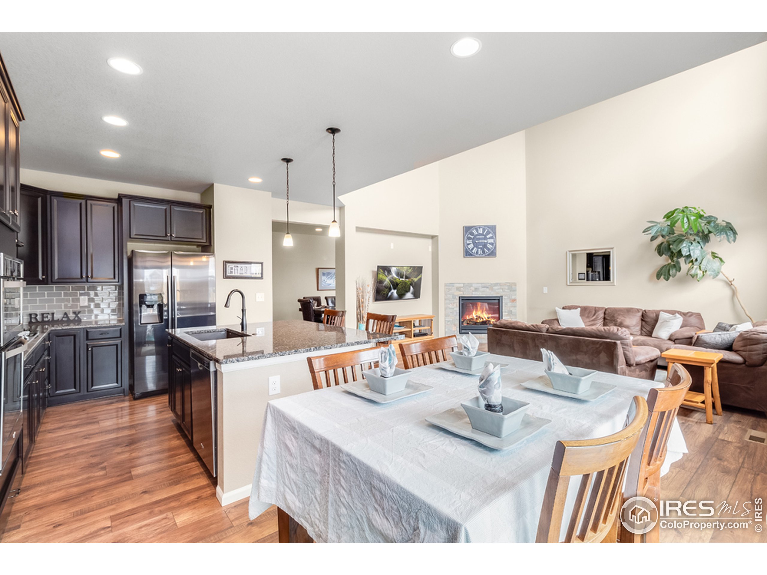 6559 Tombstone Ridge Road Timnath, CO 80547 - Photo 7 of 30 a view of a kitchen and dining room