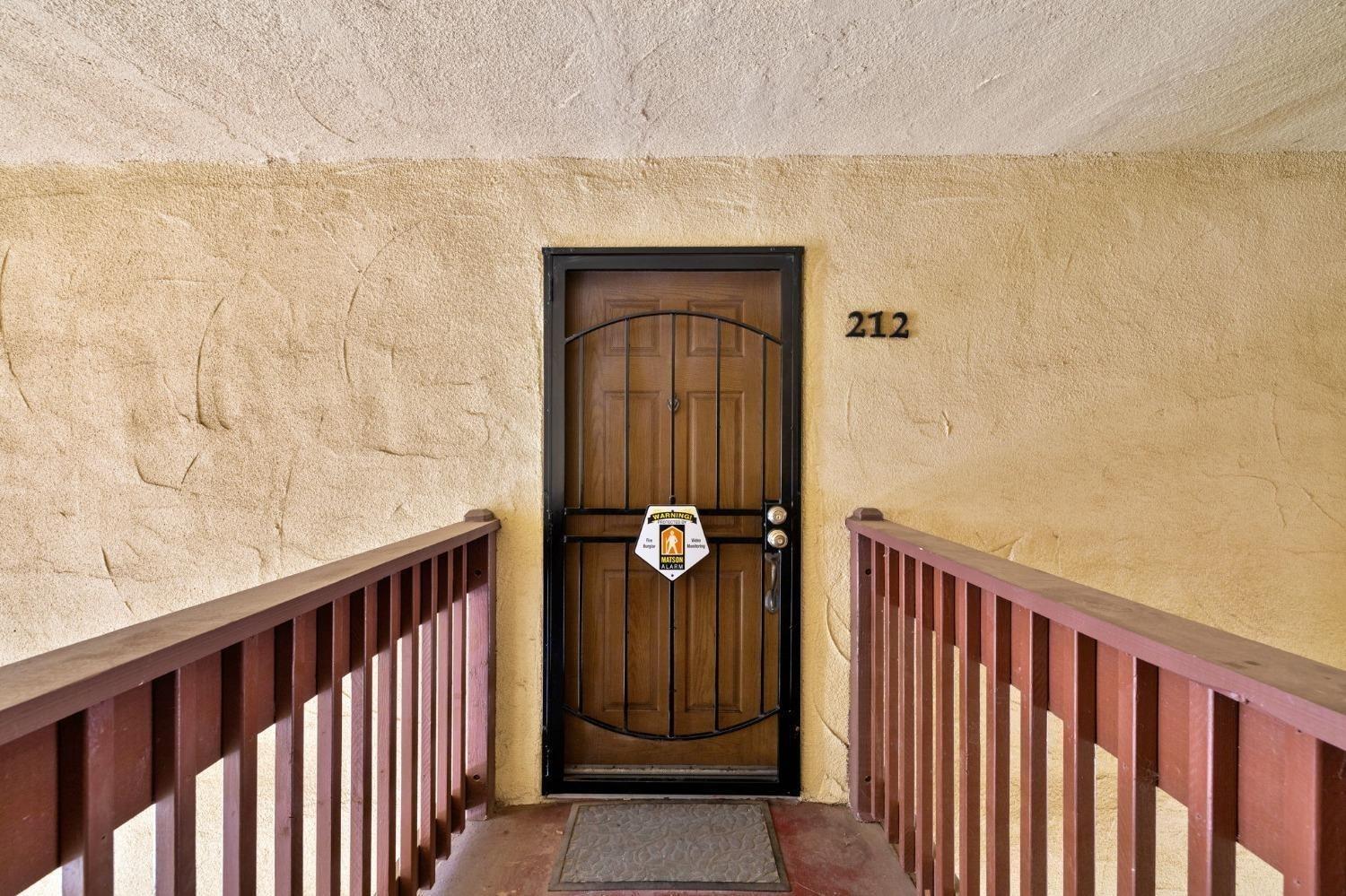 a view of a entryway door with wooden floor