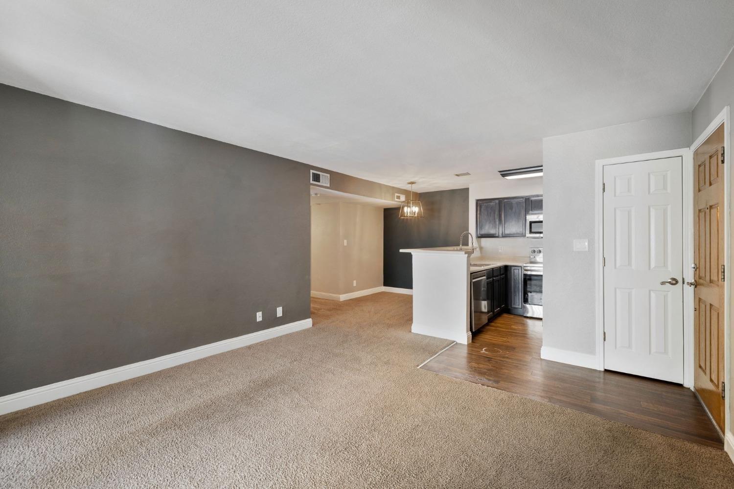 2881 Huntington Boulevard, Unit 212 Fresno, CA 93721 - Photo 4 of 17 a view of a kitchen with refrigerator and kitchen