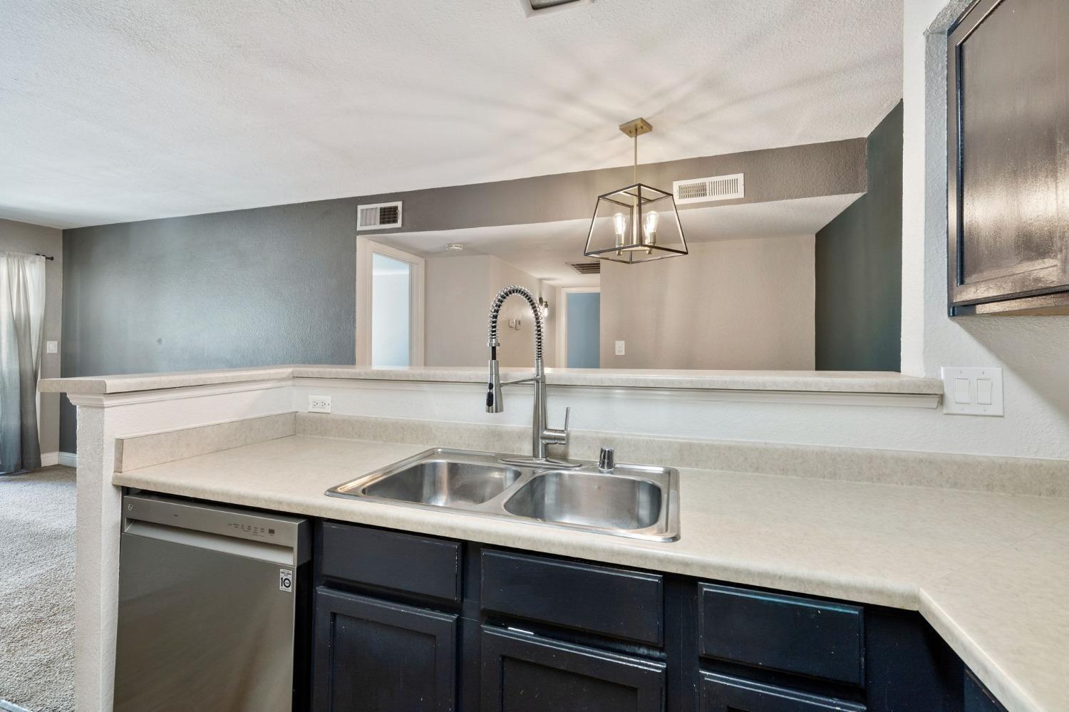 2881 Huntington Boulevard, Unit 212 Fresno, CA 93721 - Photo 8 of 17 a close view of sink and tap