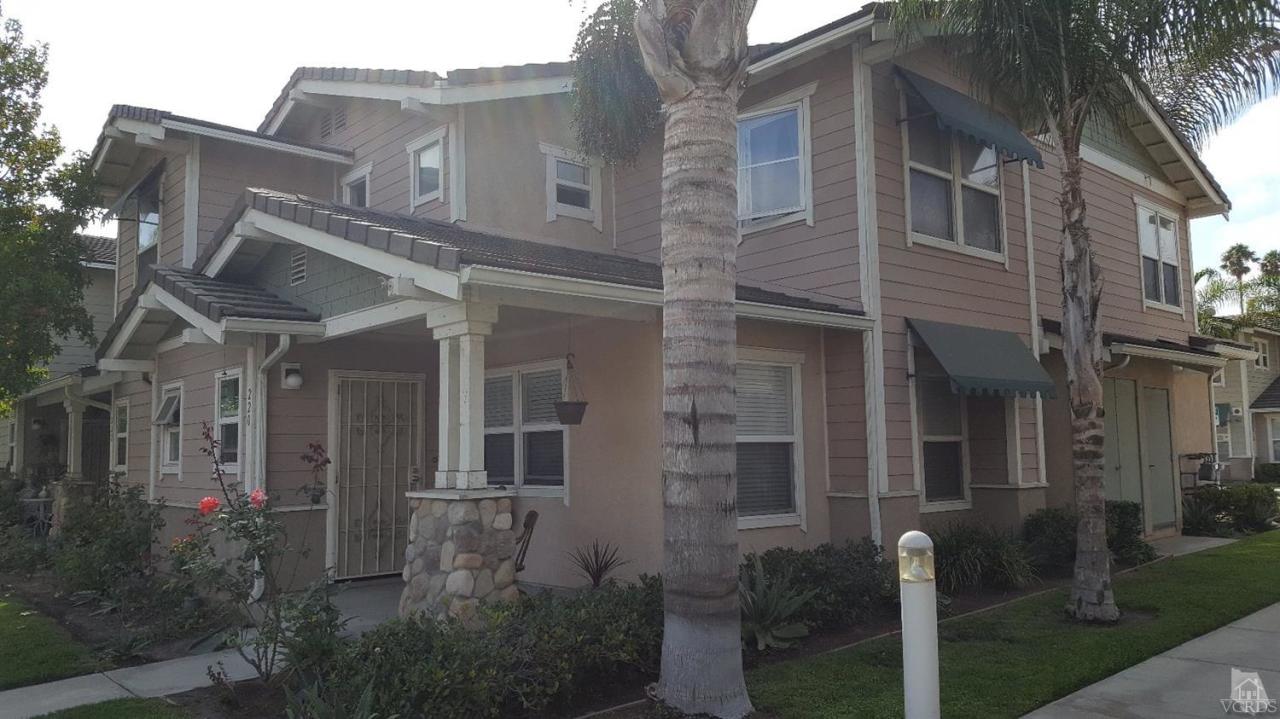 220 East 7th Street Oxnard, CA 93030 - Photo 2 of 9 a view of a brick building with many windows