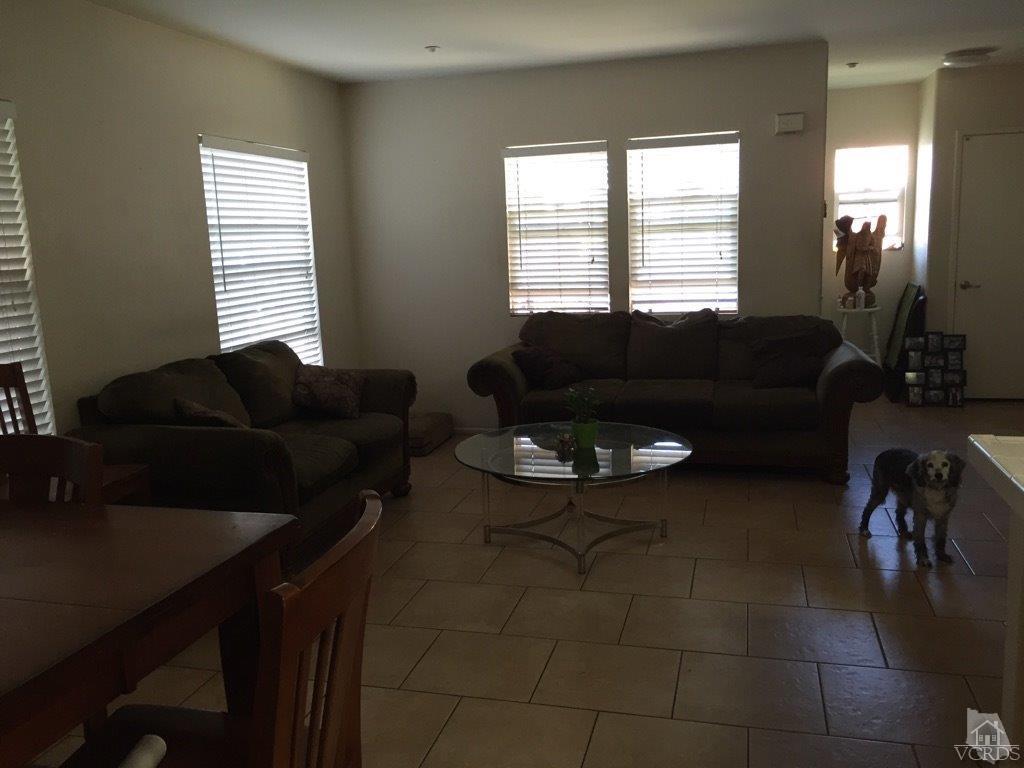 220 East 7th Street Oxnard, CA 93030 - Photo 5 of 9 a living room with furniture and a window