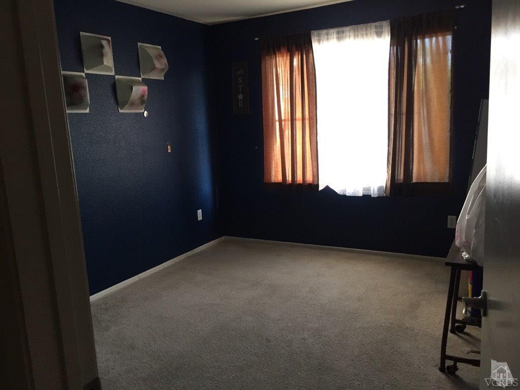 220 East 7th Street Oxnard, CA 93030 - Photo 7 of 9 a view of an empty room with a window
