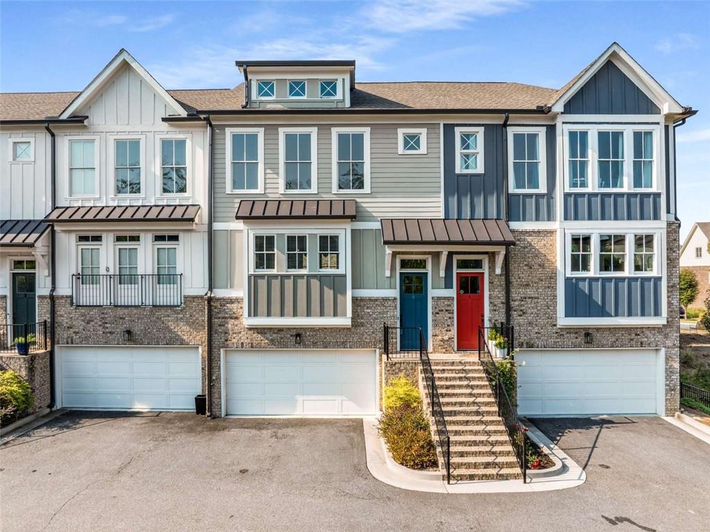 a front view of a house with many windows