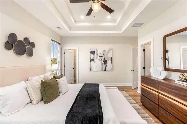 a bathroom with a double vanity sink a toilet and shower