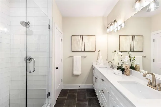 a bathroom with a double vanity sink and a mirror