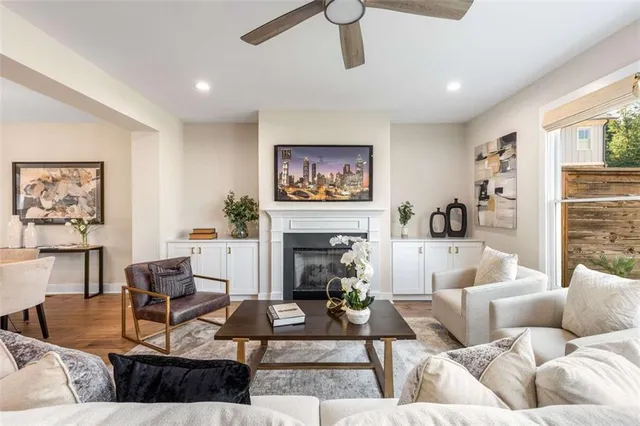 a living room with furniture and a fireplace