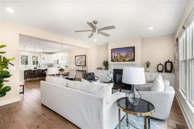 a living room with furniture a lamp and a table