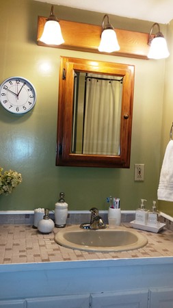 42 Boston Road Andover, MA 01810 - Photo 15 of 23 a bathroom with a granite countertop sink and a mirror