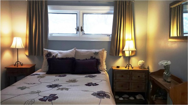 42 Boston Road Andover, MA 01810 - Photo 10 of 23 a bed sitting in a bedroom next to a window