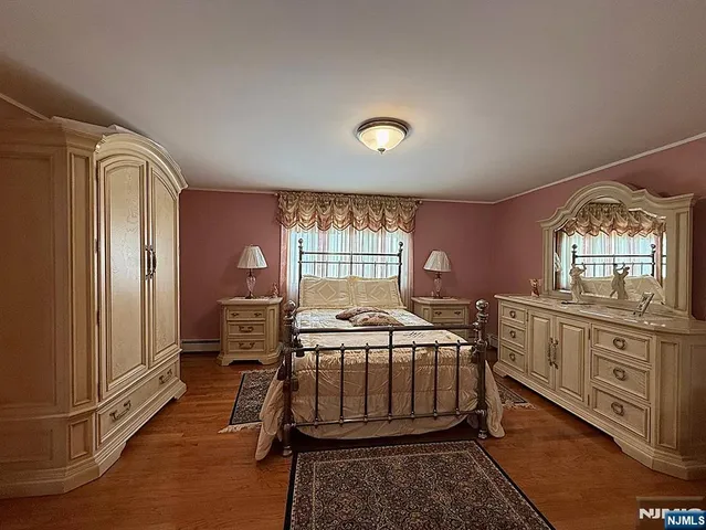 a bed room with a bed and a window