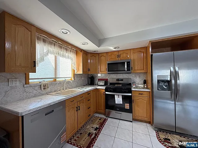 a dining room with granite countertop furniture a sink and a window