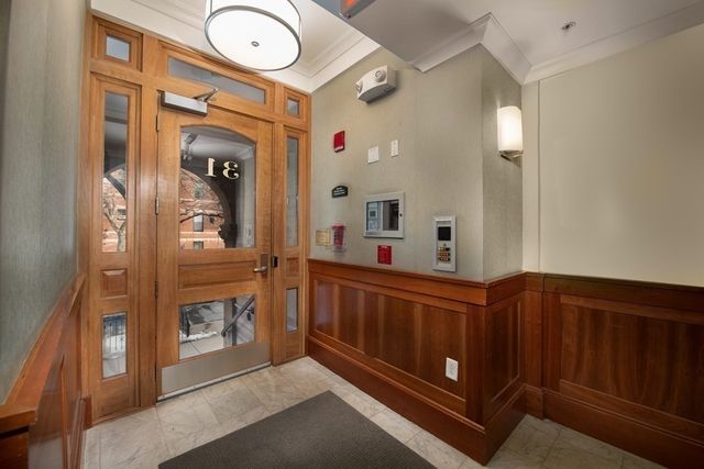 a view of a hallway with washer and dryer