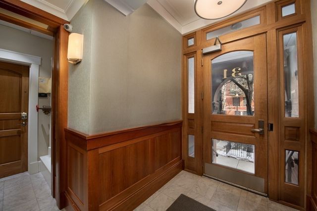 a hallway with sliding door and windows