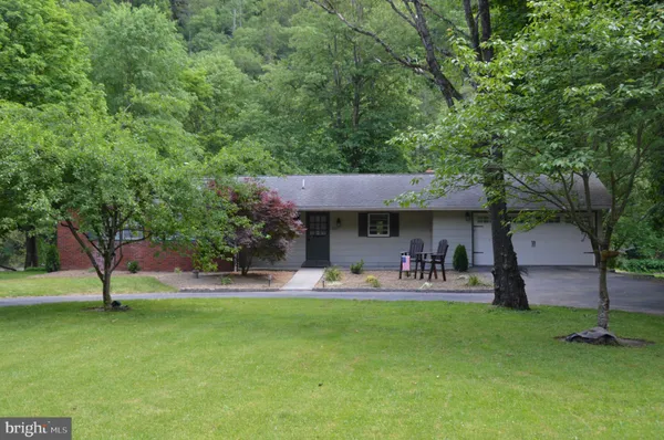 a kitchen with stainless steel appliances a stove a sink and a refrigerator
