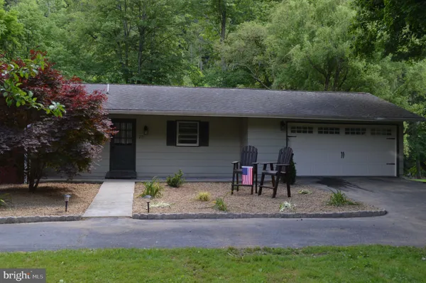 a front view of a house with swimming pool