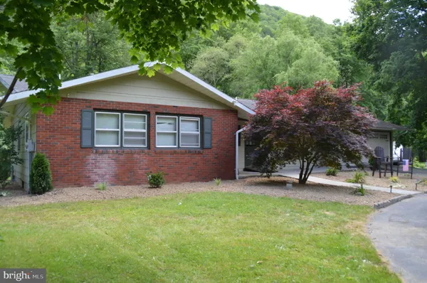 a view of a chairs and tables in patio