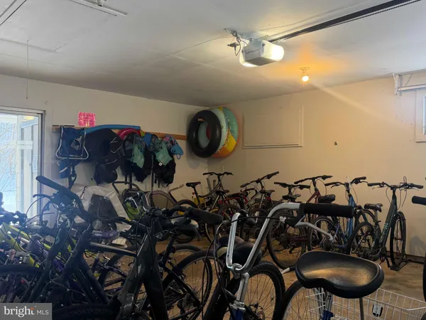 a bathroom with a granite countertop shower a toilet and a sink