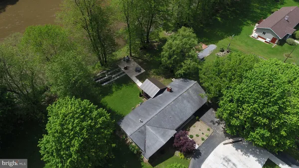 a view of a house with backyard porch and sitting area