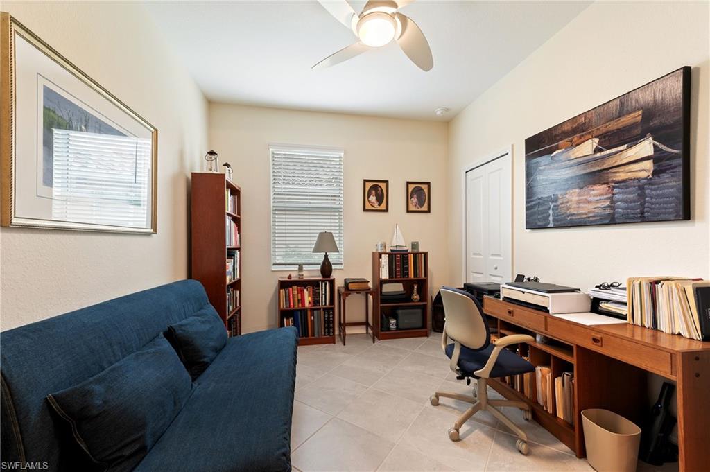 2652 Vine Avenue Naples, FL 34120 - Photo 15 of 40 a livingroom with workspace and a couch