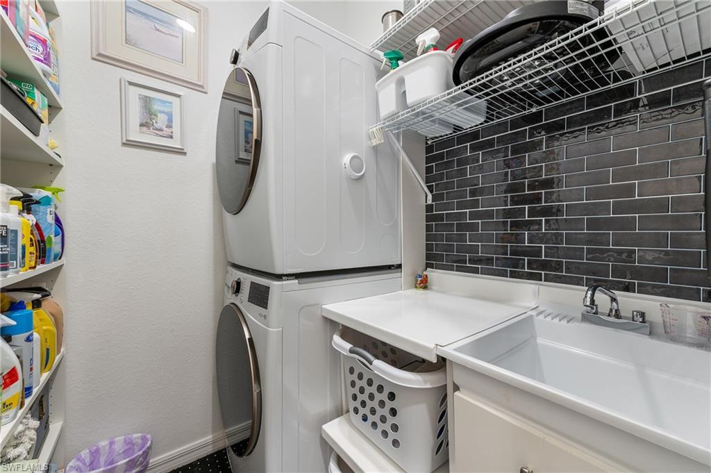 2652 Vine Avenue Naples, FL 34120 - Photo 17 of 40 a utility room with dryer and washer