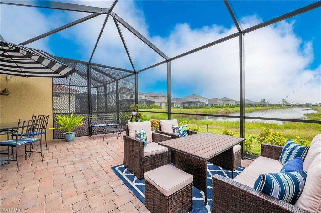 2652 Vine Avenue Naples, FL 34120 - Photo 18 of 40 a view of a patio with swimming pool