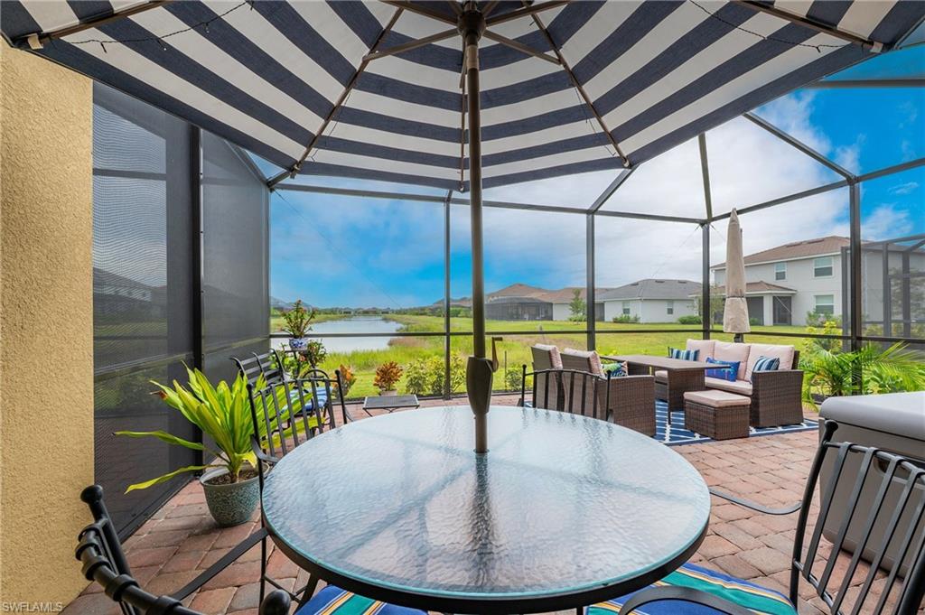 2652 Vine Avenue Naples, FL 34120 - Photo 19 of 40 a view of a dining room with furniture window and outside view