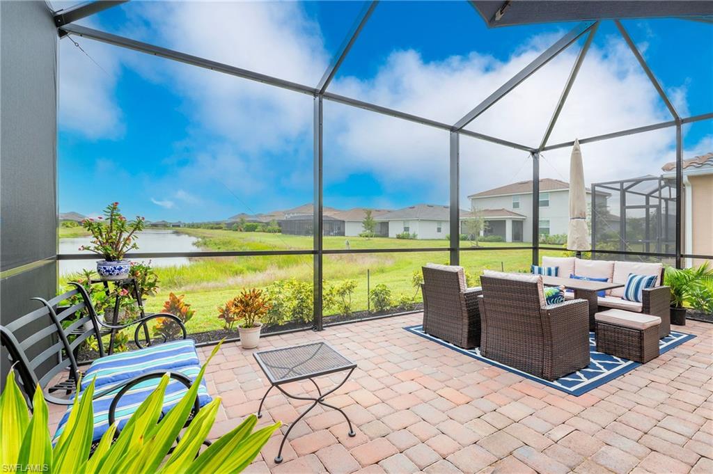 2652 Vine Avenue Naples, FL 34120 - Photo 20 of 40 a view of swimming pool with a lounge chairs