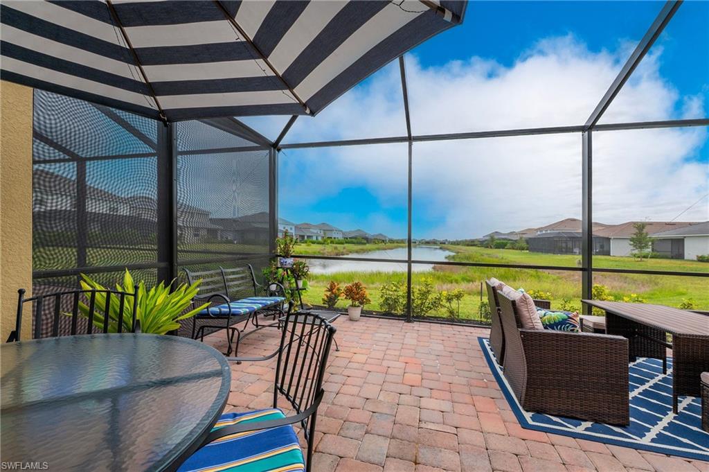 2652 Vine Avenue Naples, FL 34120 - Photo 21 of 40 a view of swimming pool with outdoor seating
