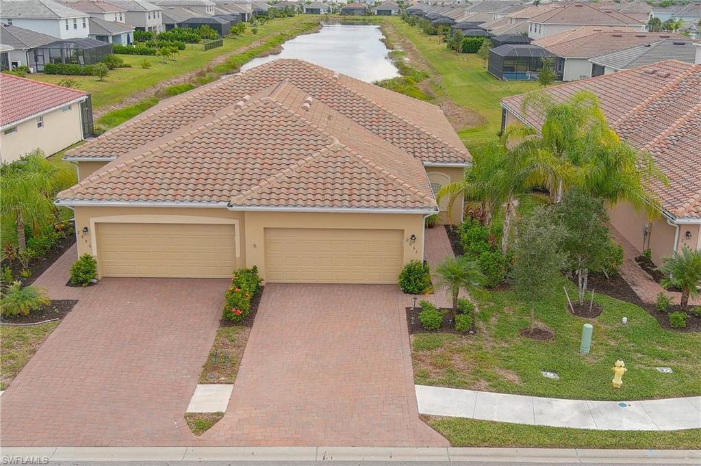 2652 Vine Avenue Naples, FL 34120 - Photo 23 of 40 a front view of a house with garden