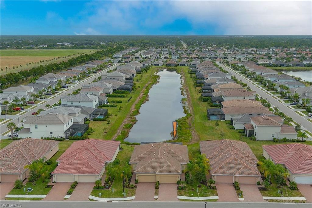 2652 Vine Avenue Naples, FL 34120 - Photo 28 of 40 an aerial view of ocean and residential houses with outdoor space