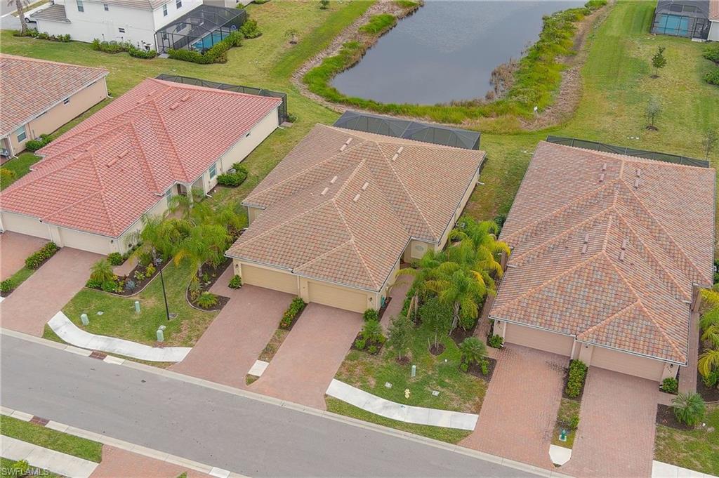 2652 Vine Avenue Naples, FL 34120 - Photo 30 of 40 an aerial view of a house with a yard and a garage