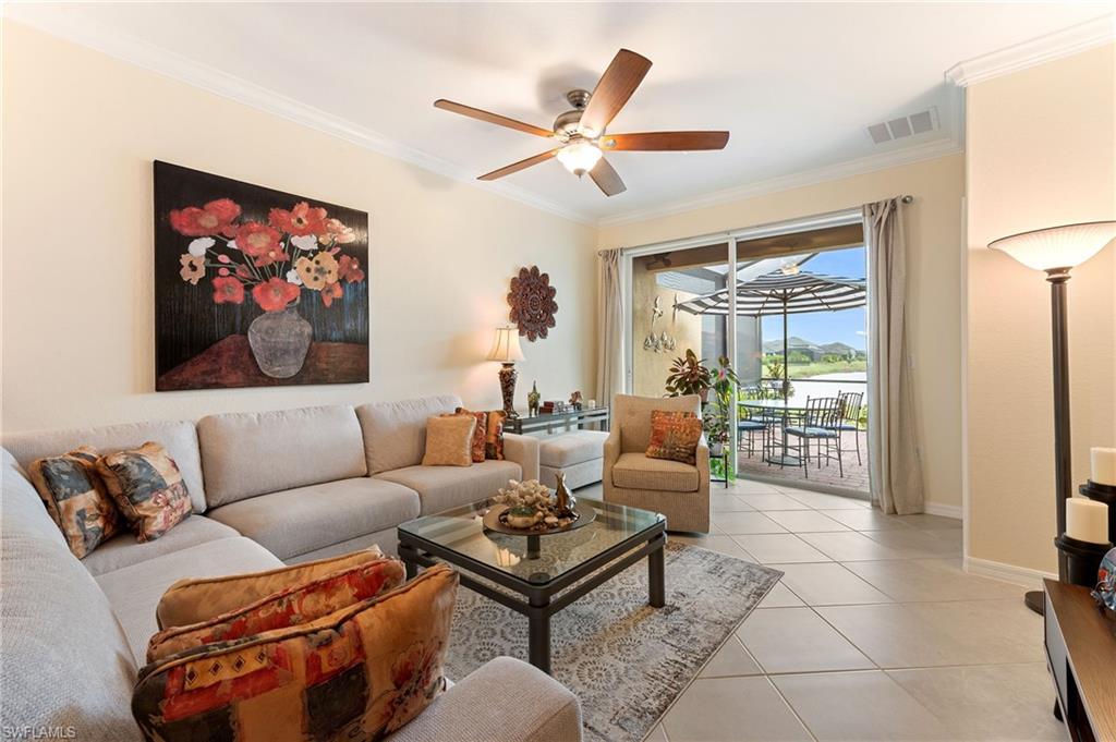 2652 Vine Avenue Naples, FL 34120 - Photo 3 of 40 a living room with furniture and a large window