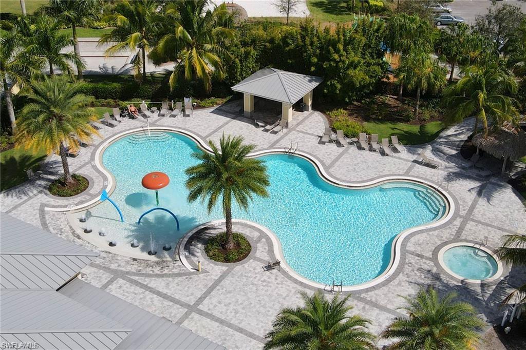 2652 Vine Avenue Naples, FL 34120 - Photo 35 of 40 swimming pool view with a garden space
