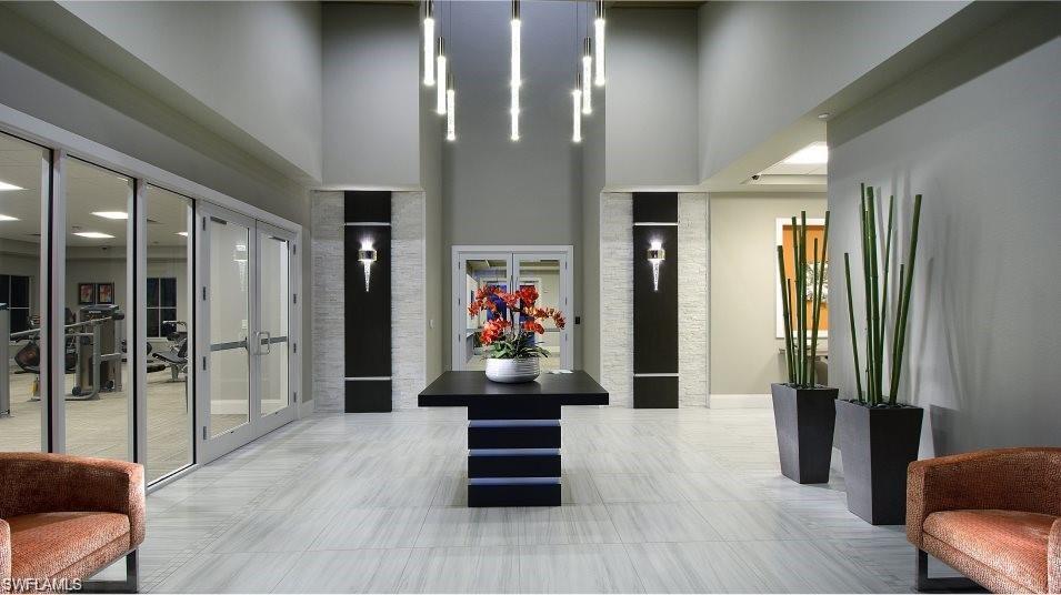 2652 Vine Avenue Naples, FL 34120 - Photo 37 of 40 a room with wooden floor and furniture