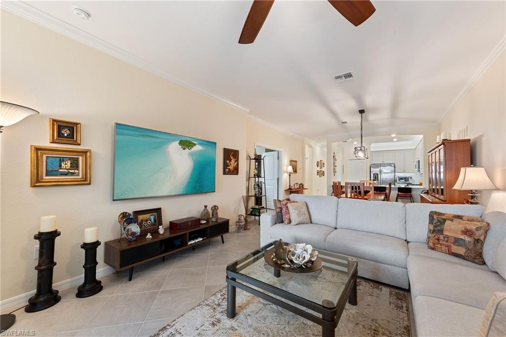 2652 Vine Avenue Naples, FL 34120 - Photo 5 of 40 a living room with furniture and a flat screen tv