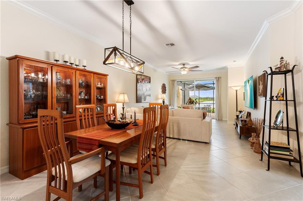 2652 Vine Avenue Naples, FL 34120 - Photo 6 of 40 a dining room with furniture and window