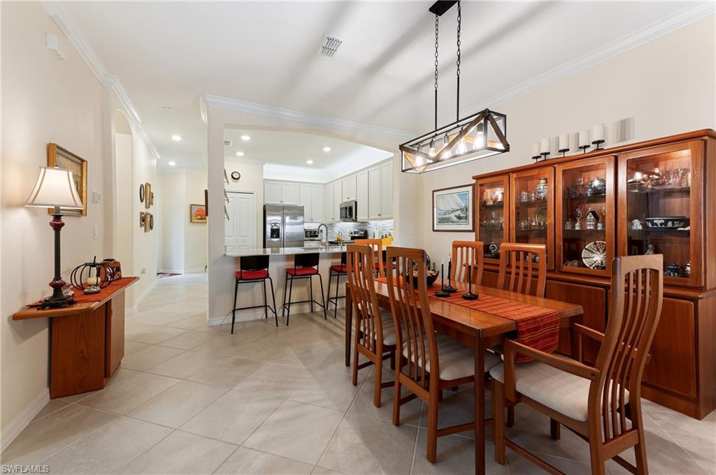 2652 Vine Avenue Naples, FL 34120 - Photo 8 of 40 a view of a dining area with furniture