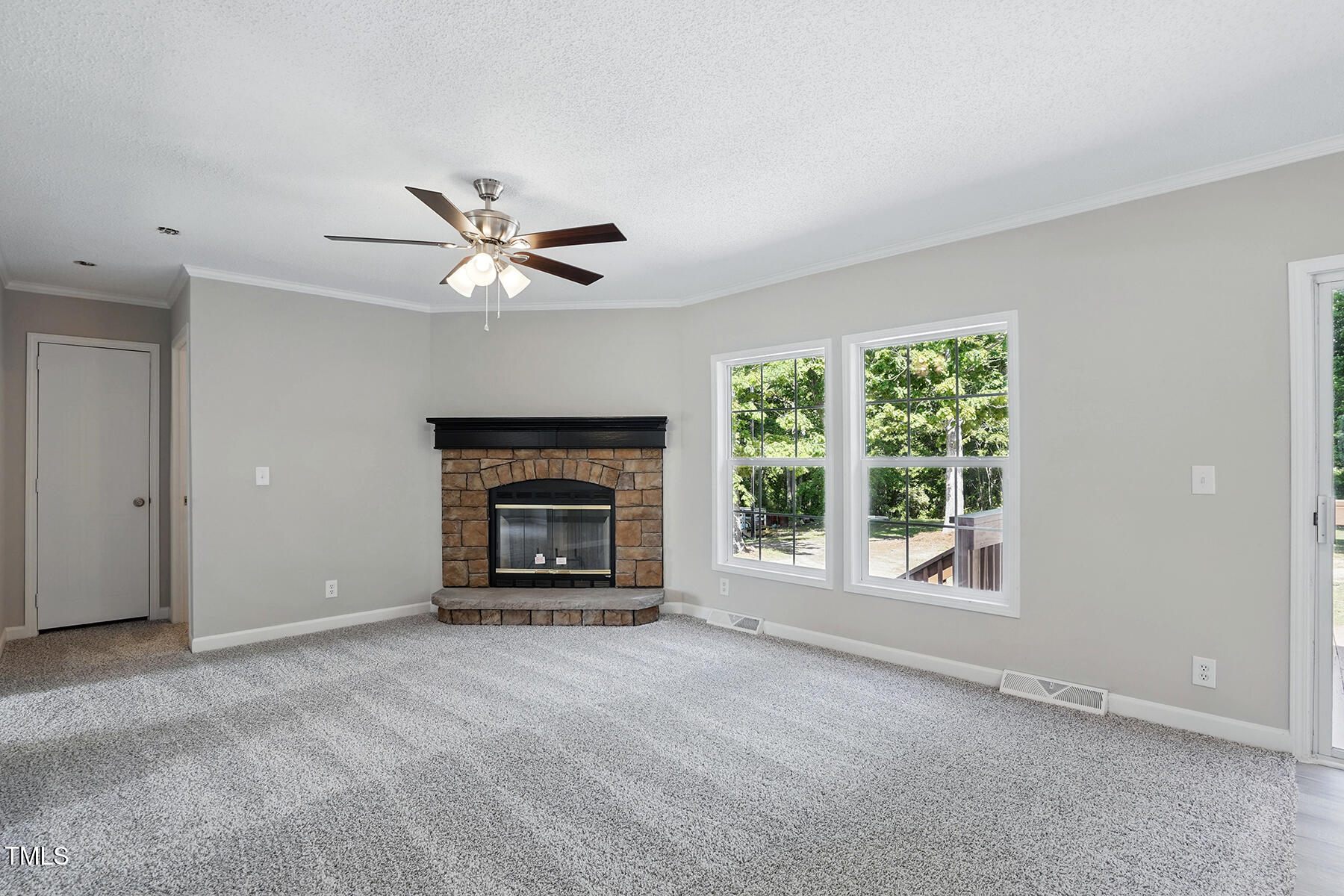 4467 Virgilina Road Roxboro, NC 27574 - Photo 13 of 30 a view of an empty room with a fireplace