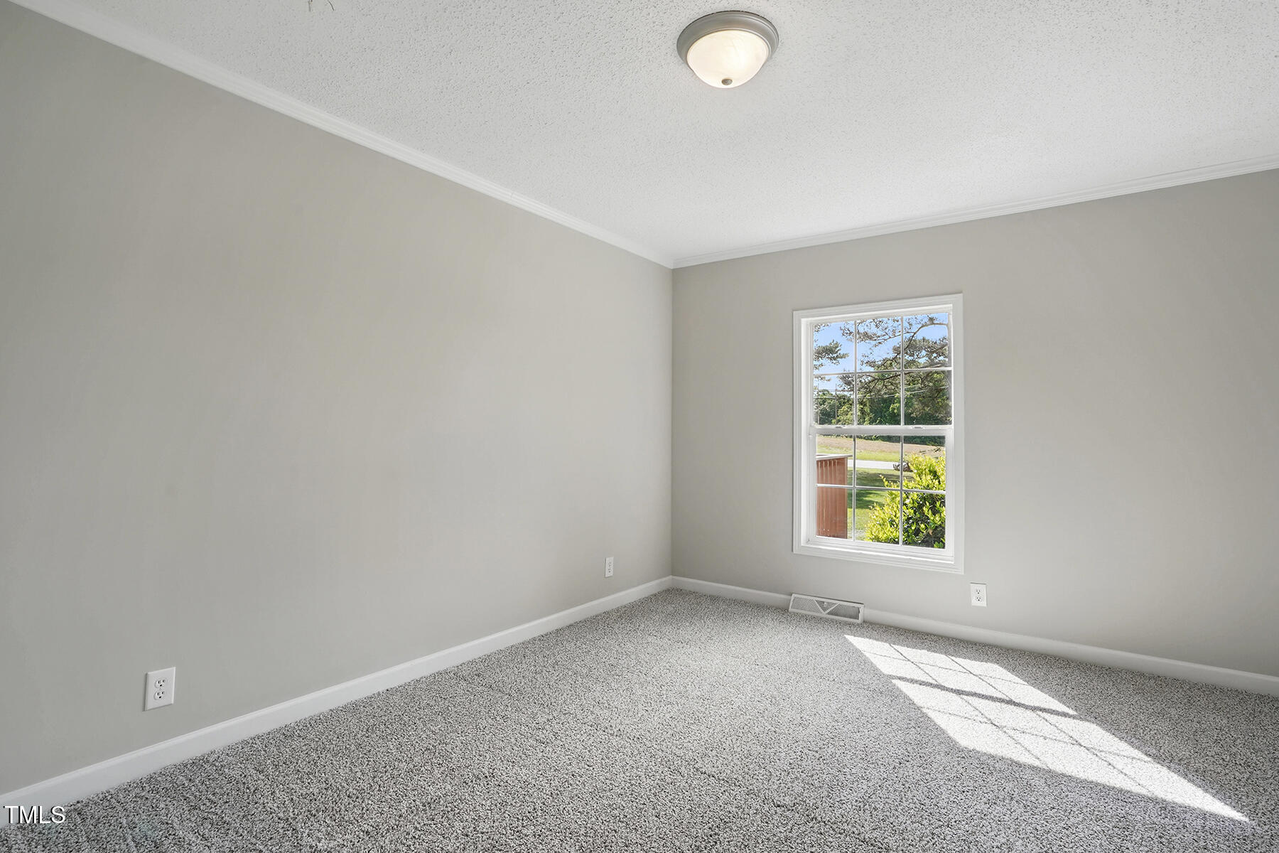 4467 Virgilina Road Roxboro, NC 27574 - Photo 17 of 30 an empty room with windows