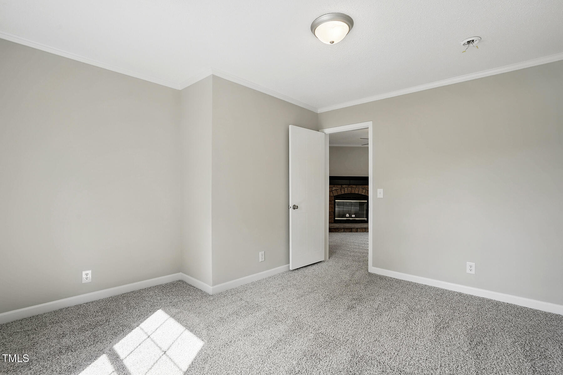 4467 Virgilina Road Roxboro, NC 27574 - Photo 18 of 30 an empty room with closet and a window