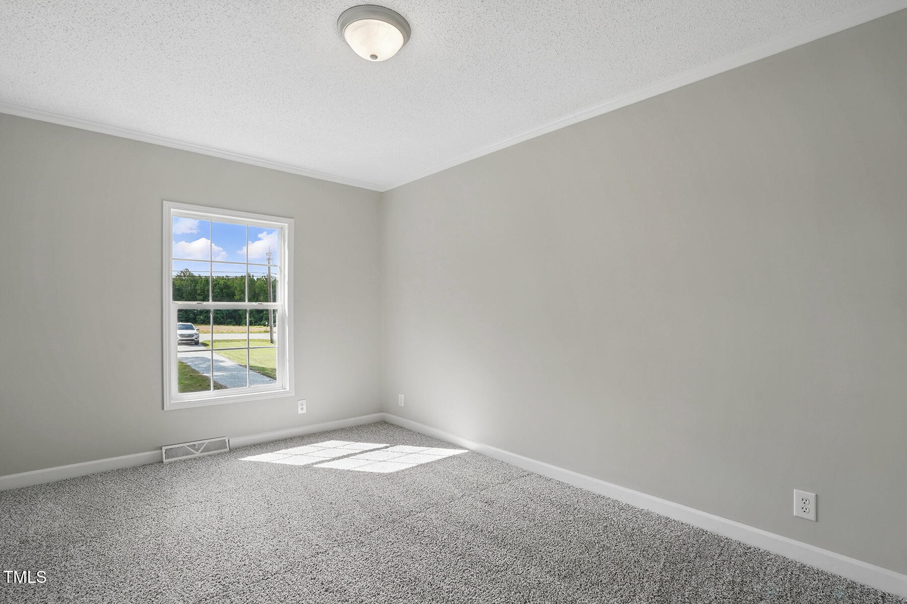 4467 Virgilina Road Roxboro, NC 27574 - Photo 19 of 30 an empty room with a window