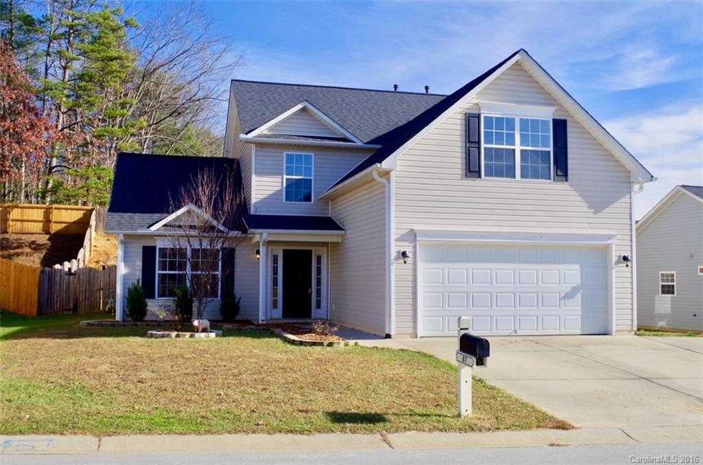 87 Yadkin Road, Unit 327 Fletcher, NC 28732 - Photo 1 of 23 a front view of a house with a yard