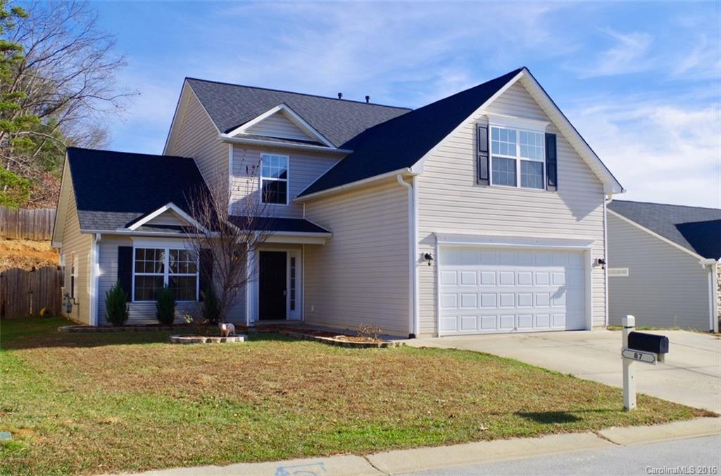87 Yadkin Road, Unit 327 Fletcher, NC 28732 - Photo 2 of 23 a front view of a house with a yard